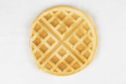 The light brown bottom crust of a waffle baked for 7 minutes using our Birch Benders batter.