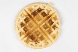 The very light gold-dark brown bottom crust of a waffle baked for 3 minutes using a batter made from the Birch Benders mix.