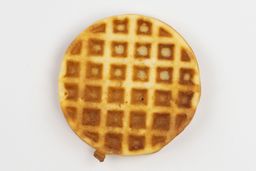 The golden-very dark brown bottom crust of a waffle baked for 6 minutes using our self-mixed recipe.