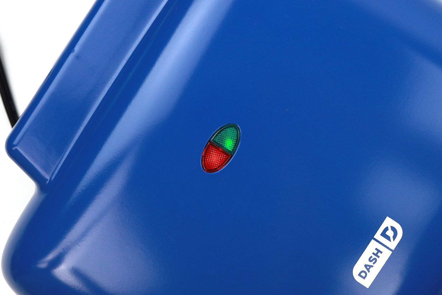 Indicator lights at the top of the DASH No-Drip waffle maker. Left is the red POWER light and right is the green READY light.