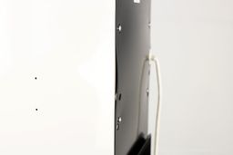 Close up of the Avalon A1 water cooler side panel and rear plate  with two ventilation holes visible on the bottom left.