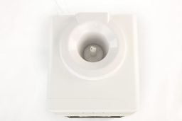 A top view of a water cooler dispensing showing the water guard and the water needle inside.