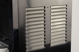 Ventilation slats on the side body of a freestanding water cooler dispenser.