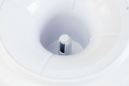 Close-up of a water needle of a top-loading water cooler dispenser.