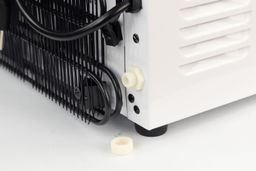 A close up of the position of the electric cord in close proximity to the water drainage port of a water cooler dispenser.