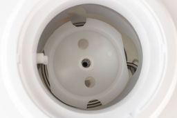 A top down view of a typical water baffle found in the tank of a top loading water cooler dispenser.