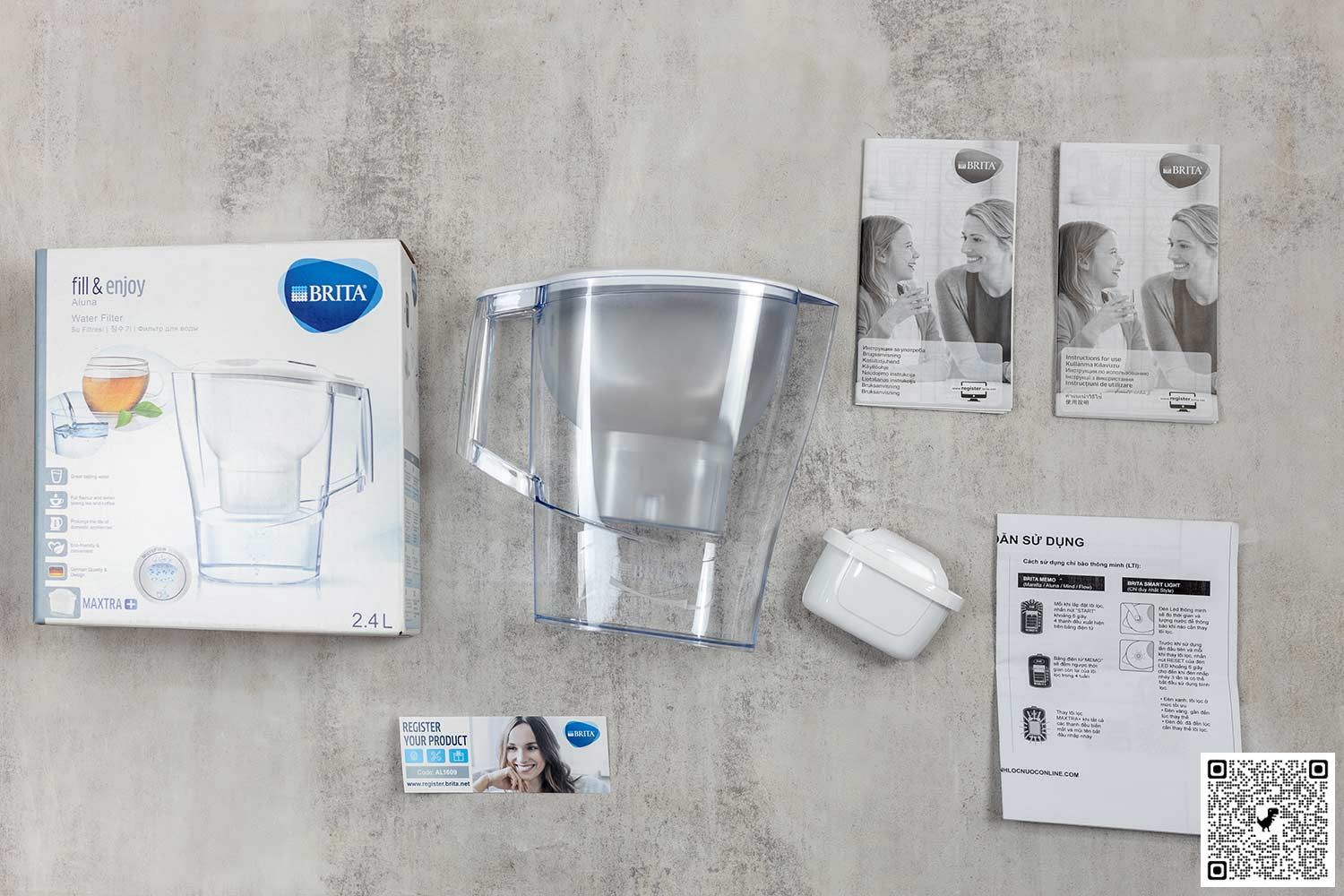 The Brita Aluna water filter pitcher, its packaging, filter, user manuals, registration card