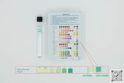 Test tube labeled Brita Marella next to test kit box and magnified results
