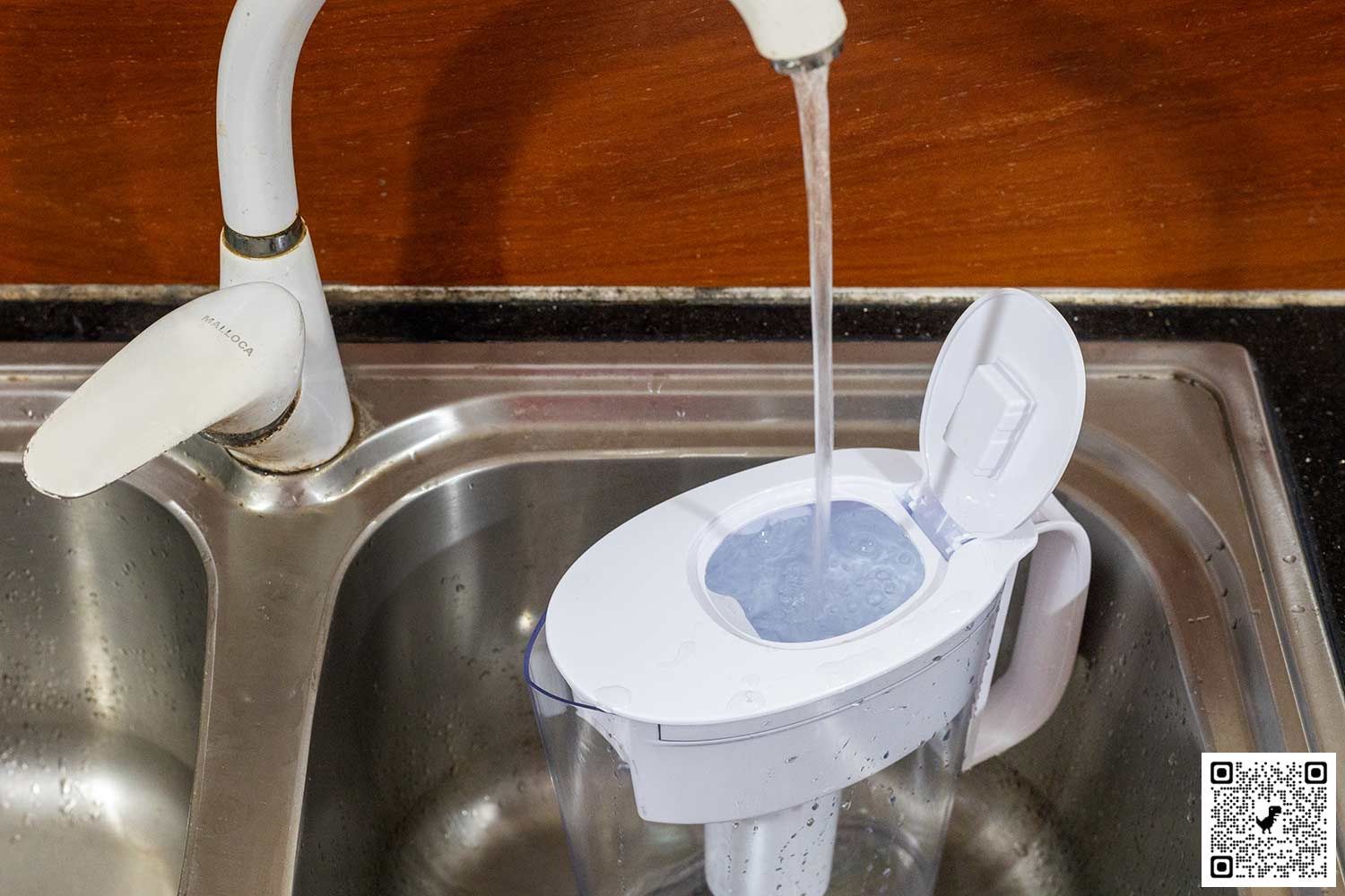 The Brita Metro in a kitchen sink, being refilled under a running faucet