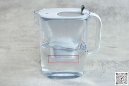 A full Brita Style jug and a marker marking the area below its filter