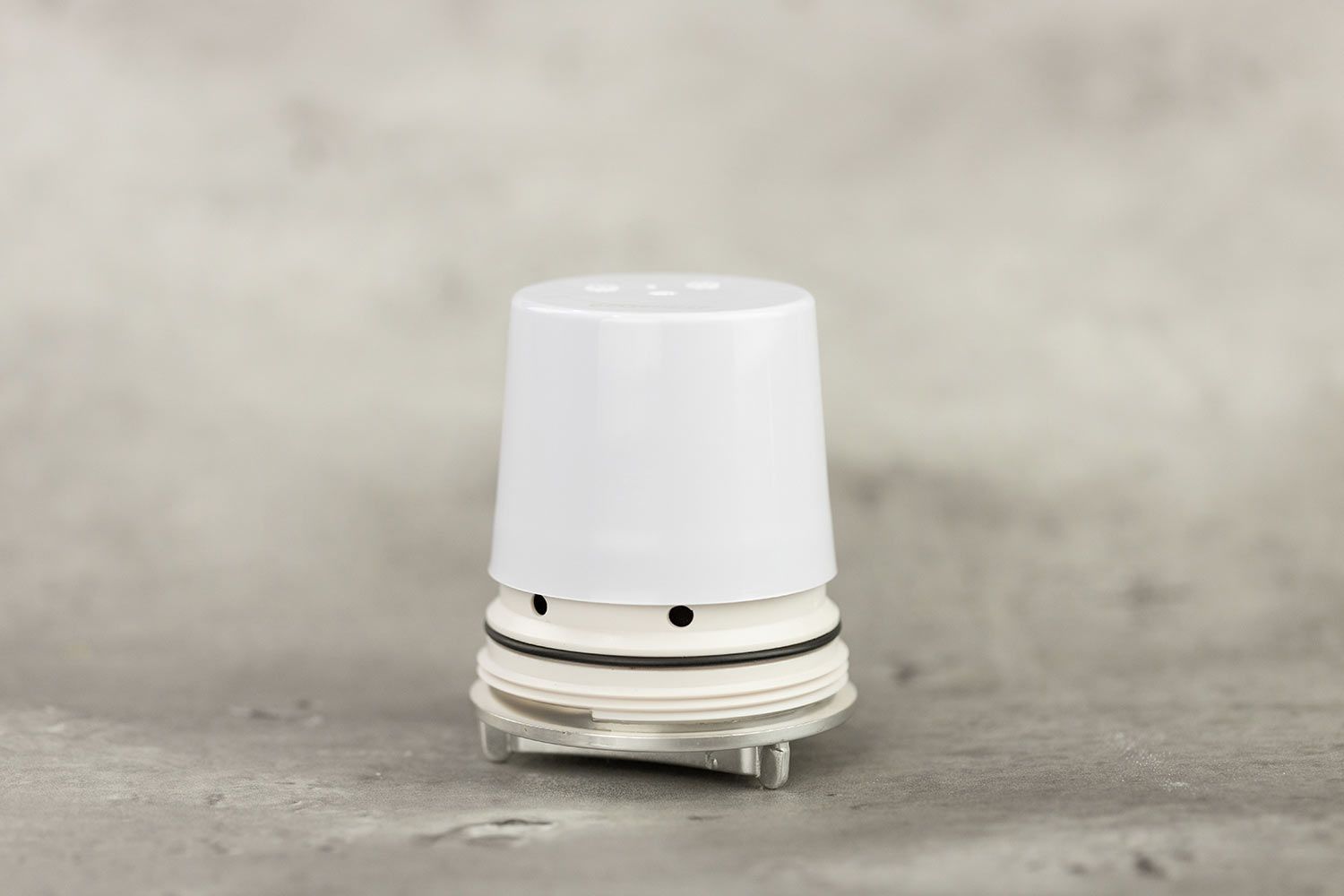 The filter piece of the Culligan FM-25 faucet-mount water filter, with white plastic casing and chrome-plated end piece.