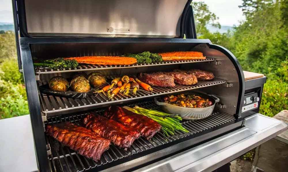 A pellet grill with triple-decked grates